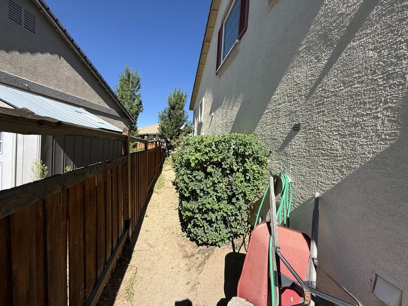 Neatly trimmed hedge line maintained by Spanish Springs Lawn Care