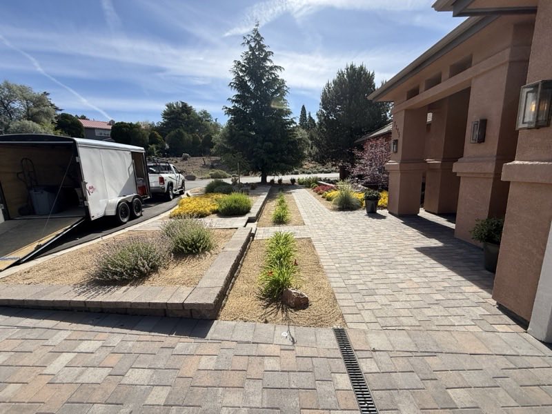 Paver walkway and landscaped garden beds installed by Spanish Springs Lawn Care