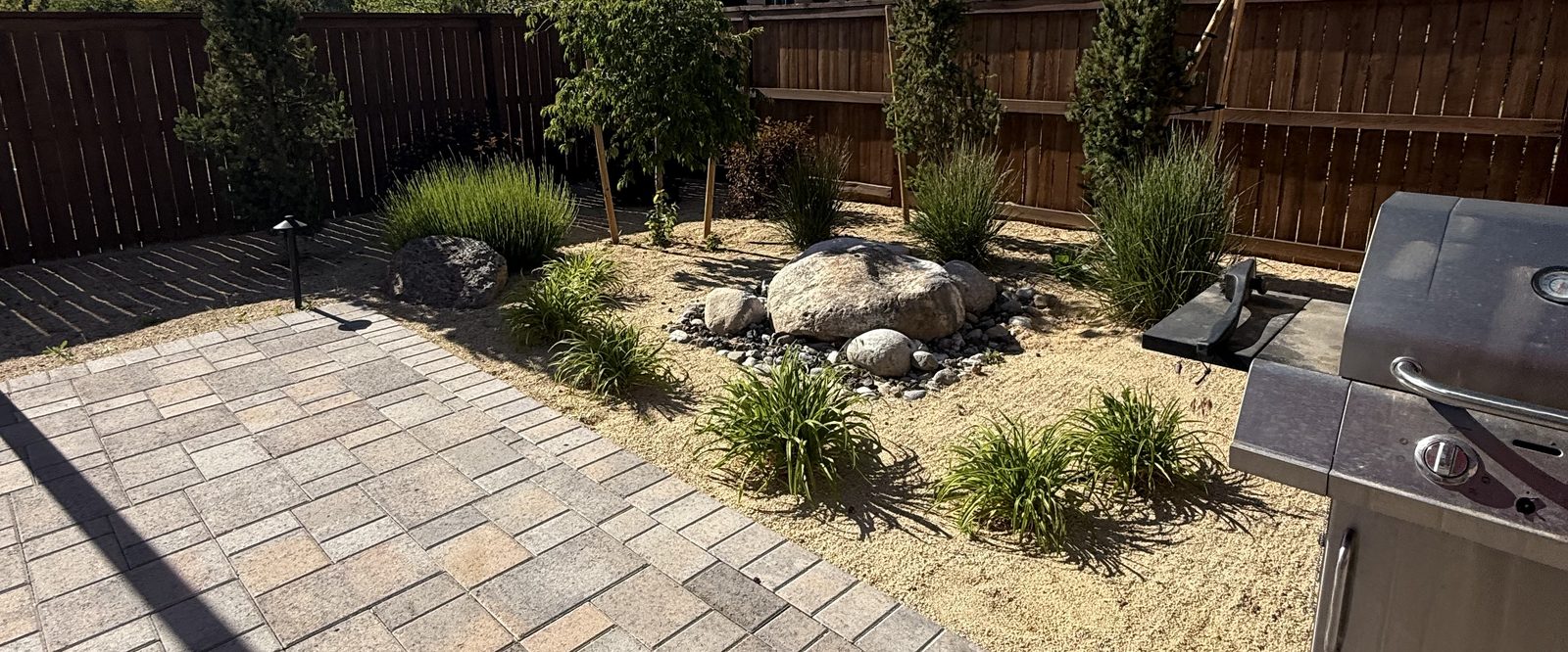 Yard cleared of debris after a seasonal cleanup by Spanish Springs Lawn Care